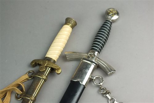 Lot 382 - Two reproduction German daggers and an American reproduction sword