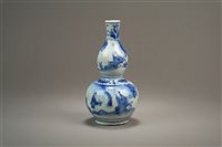 Lot 24 - A Chinese Blue and White Gourd vase