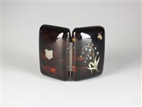 Lot 110 - An inlaid tortoiseshell purse