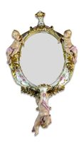 Lot 189 - A German porcelain oval mirror