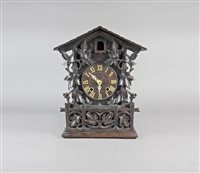 Lot 207 - A Black Forest style stained pine case cuckoo clock