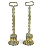 Lot 164 - A pair of lead weighted brass door porters