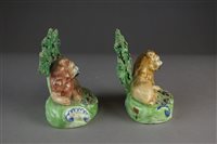 Lot 92 - A pair of Walton Staffordshire pearlware lions