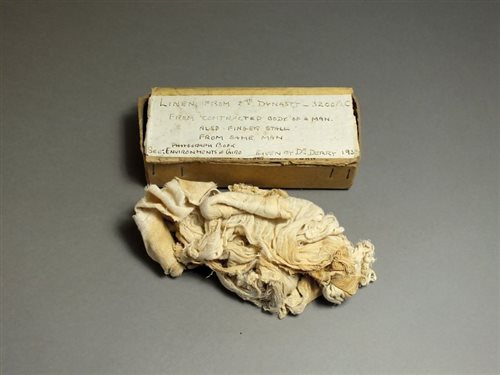 Lot 33 - Egyptian; cardboard box containing linen strips used in mummification