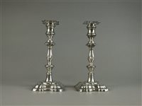 Lot 33 - A pair of silver mounted candlesticks