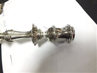 Lot 33 - A pair of silver mounted candlesticks