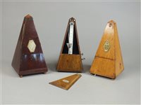 Lot 274 - Three metronomes