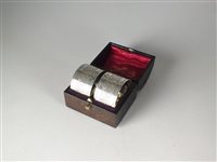 Lot 40 - A cased pair of silver napkin rings