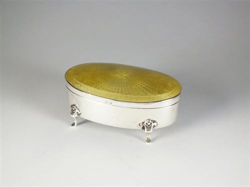 Lot 18 - A silver and enamel oval trinket box