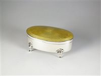 Lot 18 - A silver and enamel oval trinket box