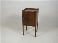 Lot 386 - An Edwardian mahogany and boxwood strung pot cupboard