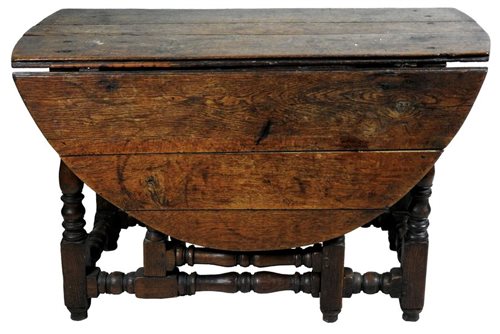 Lot 315 - An oval oak drop-leaf dining table, 17th century