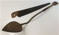 Lot 150 - An early 20th Century hand saw and peat cutter