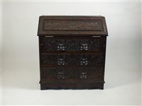 Lot 377 - A Victorian carved oak bureau