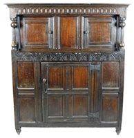 Lot 472 - A carved oak court cupboard