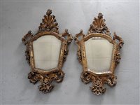 Lot 319 - A pair of Venetian giltwood wall mirrors