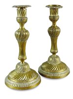 Lot 127 - A pair of Louis XVI design wrythen twist gilt bronze candle sticks