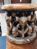 Lot 152 - A Nigerian carved wood stool