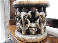 Lot 152 - A Nigerian carved wood stool