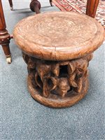 Lot 152 - A Nigerian carved wood stool