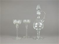 Lot 73 - Six tall stemmed drinking glasses with matching decanter and stopper, and six rummers with engraved leaf design