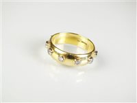 Lot 189 - An 18ct gold diamond set band