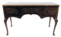 Lot 497 - A cross banded walnut side table