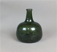 Lot 318 - An 18th century green glass onion bottle