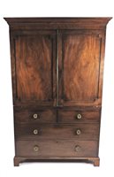 Lot 566 - A late George III mahogany and ebony strung linen press