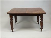 Lot 488 - An Edwardian walnut wind-out extending dining table