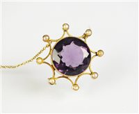 Lot 71 - An amethyst and seed pearl brooch