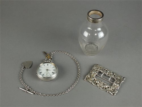 Lot 49 - A silver open face pocket watch with chain and fob