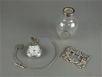 Lot 49 - A silver open face pocket watch with chain and fob