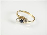 Lot 239 - A 9ct gold sapphire and diamond ring