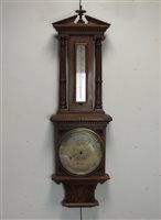 Lot 262 - A Victorian oak cased aneroid barometer