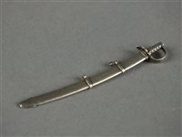 Lot 47 - A novelty white metal sword and scabbard toothpick by G.Riddle