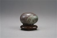 Lot 82 - A Chinese polished bloodstone jasper egg and three other hardstone carvings