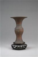 Lot 357 - A small Chinese bronze baluster vase, Gu