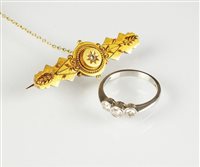 Lot 250 - A platinum three stone diamond ring