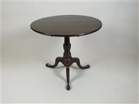 Lot 381 - A late George III oak tripod table