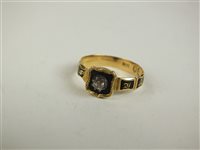 Lot 119 - A 19th century diamond and black enamel mourning ring