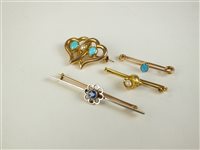 Lot 105 - A turquoise and seed pearl witches heart brooch