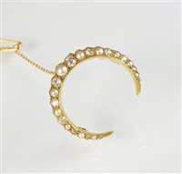 Lot 255 - A late 19th century pearl and diamond crescent brooch