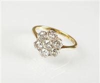 Lot 150 - A seven stone diamond floral cluster ring