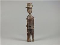 Lot 251 - An unusual African carving of a European soldier