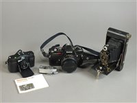 Lot 289 - A Konica SLR camera and lens and other photographic equipment