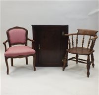 Lot 410 - An elm and beech smokers bow arm chair