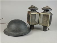 Lot 308 - A pair of coaching lamps converting to electricity and a lined warden’s helmet