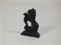 Lot 507 - A cast iron lion door porter