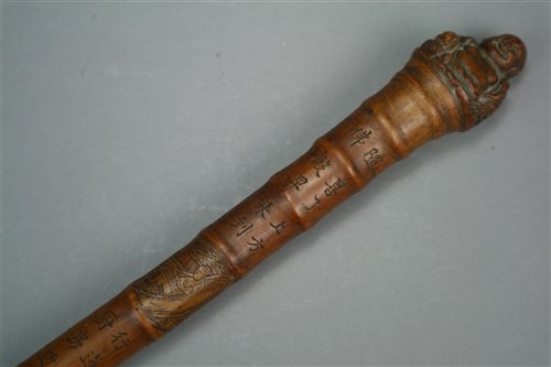 Lot 126 - A Chinese Carved Bamboo Walking Cane